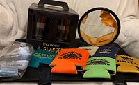 Boxed Guinness glasses, sand art decor, beer koozies overview