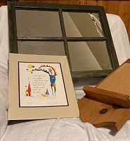 Group shot showing mirror, matted print, bulletin board