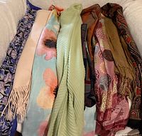 Group view of all eight scarves laid out on surface