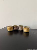 Front view of four ceramic sake cups