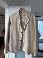 Front view of beige Zara blazer jacket on hanger