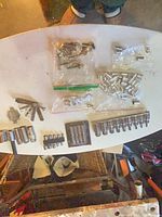 Wide view of all extractor sockets, gauges, bags of loose sockets on table