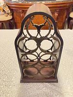 Front view showing metal lattice and bottle rings