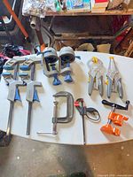 Group view of all clamps laid on white surface
