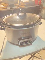 Front view of stainless Crock-Pot slow cooker with glass lid in place