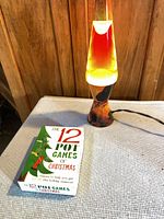 Lava lamp operating beside boxed game