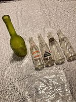 All five bottles side by side on table