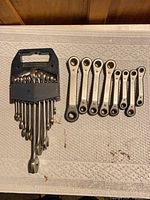 Full view of holder with wrenches and separate laid-out wrenches