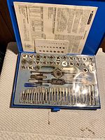 Open case showing taps, dies, wrenches and accessories