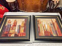 Both framed prints side by side showing frames and artwork