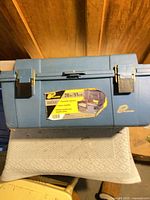 Front view showing Plano logo, size label 20 in/51 cm, metal latches