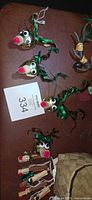 Group of cork reindeer and clothespin Santa ornaments with lot card