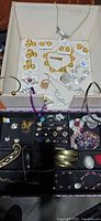 Overview of box showing Dolce Vito carded jewelry, cuffs, rings and bracelets