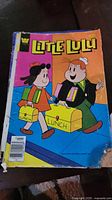 Front cover Little Lulu comic, spine and corner damage visible