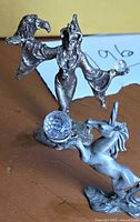 Front view of both pewter figurines with crystal spheres