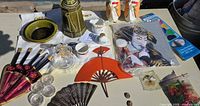 Overview of mixed Asian-themed items on table
