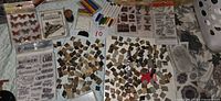Overview of craft supplies including wood mosaic chips, markers, stamp sheets, sticker packs