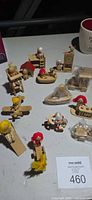 Group shot of all 13 Russ Berrie wooden miniature playsets and dolls