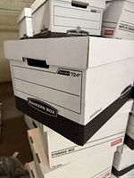 Stack of Bankers Box R-Kive 724 storage boxes showing size and labeling panels
