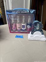 Boxed set of four Ariana Grande body mists and standalone Cloud perfume bottle