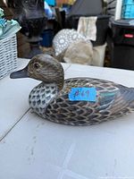 Left side view of carved wooden duck decoy