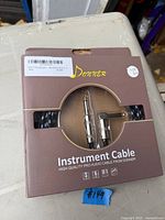 Front of Donner instrument cable box showing 10 ft length and connector types