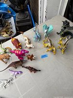Full lot of dragons and dinosaurs on table