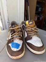 Front view of both shoes showing uppers, laces, toe boxes, and size sticker