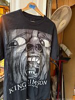 Front of black King Crimson T-shirt showing screaming face graphic and text