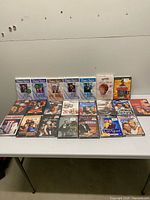 Full layout of sealed DVD collection on table