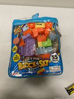 Front of carry bag showing contents and branding