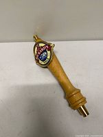 Full view of Rickard’s Pale Ale wooden tap handle