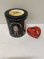 Both tins side by side showing relative size and shapes