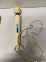 Full view of massager with cord