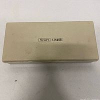 closed beige Sears Kenmore plastic case top view