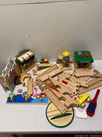 Overall lot view with buildings, track, puzzles, vehicles