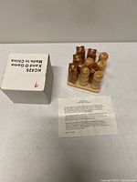 Board with shrink-wrapped pieces, instruction sheet, and original box