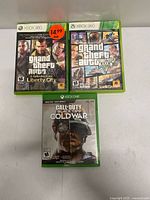 Front view of all three Xbox game cases