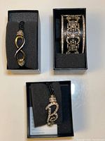 Three boxed Heidi Daus bracelets showing packaging and contents