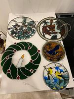 Overview of all six stained glass pieces on countertop