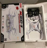 Drone, controller and accessories in open foam packaging