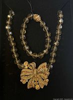 Necklace and bracelet displayed together in box