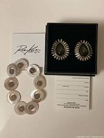 Overall lot showing Heidi Daus boxed earrings, Roz Kwan bracelet and paperwork