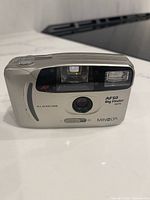 Front view of Minolta AF50 Big Finder Date camera showing lens, flash, branding