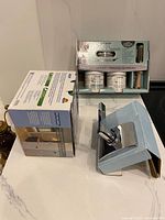 Boxed Schlage lockset, Rust-Oleum paint kit, loose chrome lever