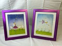 Two framed Felicity Wishes prints side by side