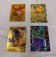 Group image of all four Pokémon cards showing fronts