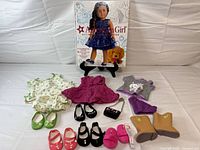 Group shot of book, clothing, shoes and purse