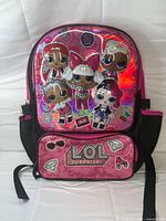 Front view of backpack showing main compartment, front pocket, side mesh pockets