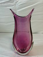 Front view showing amethyst color, clear cased base, fishtail rim